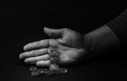 Coins spilling from the hand