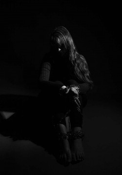 A woman bound in chains