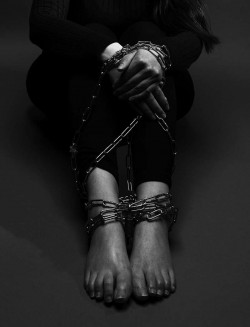 Arms and legs in chains